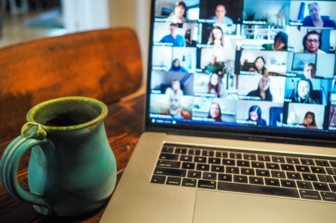 This person is having a zoom Meeting with his colleagues with whom she always has daily meetings to remain connected and share what they have learnt over the project while perceiving the benefits of the nearshore outsourcing working model